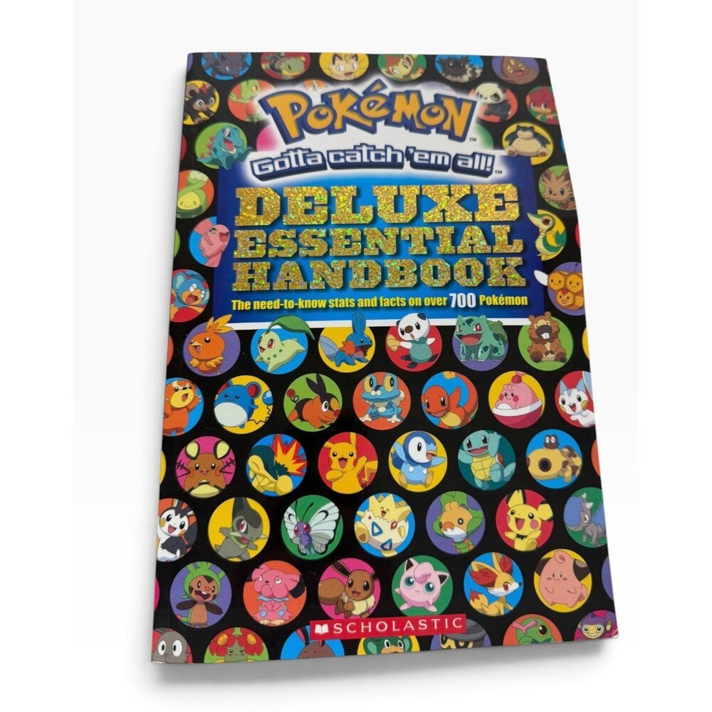 Pokemon Deluxe Essential Handbook by Scholastic Paperback First Edition
